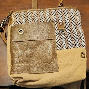 This is a Myra Bag Tribal Stripe Front Pocket Upcycled Canvas & Cowhide Leather
